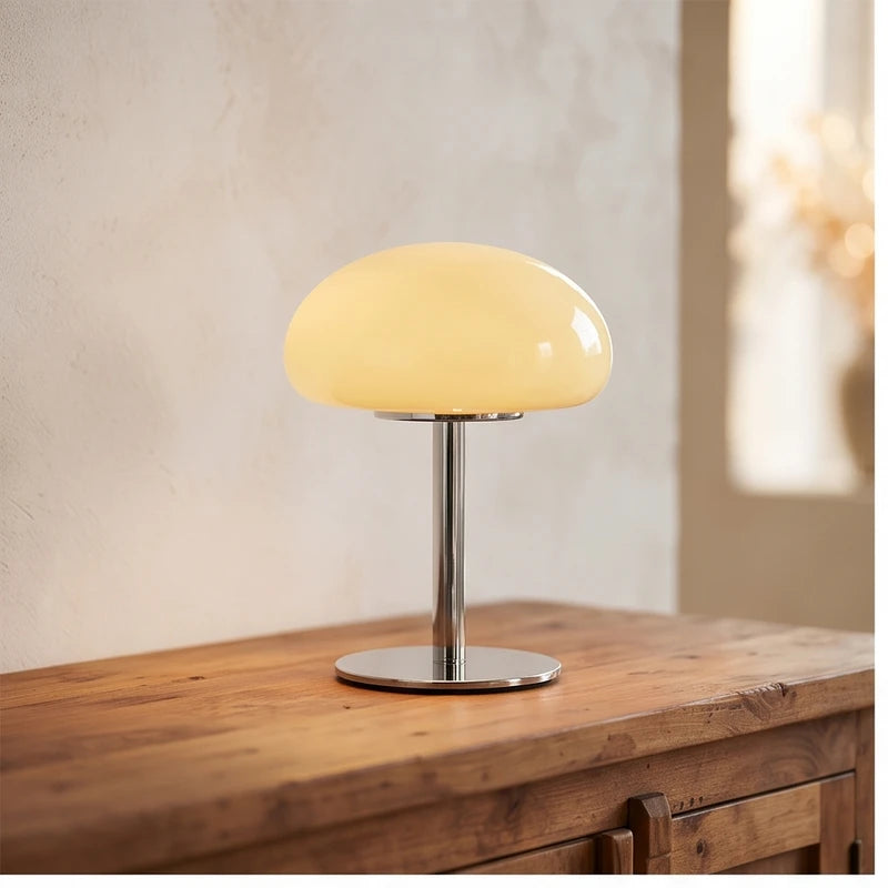 Cream glass lamp styled in a warm home setting