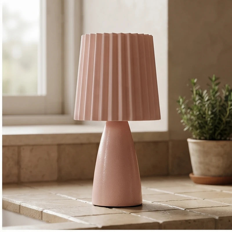 Pink ceramic lamp styled in a warm home setting - 2
