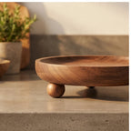 Walnut ball A wooden tray styled in a warm home setting - 3