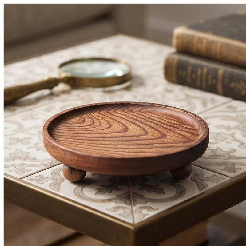 Walnut ball A wooden tray styled in a warm home setting - 4