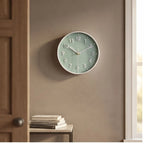 Green clock styled in a warm home setting