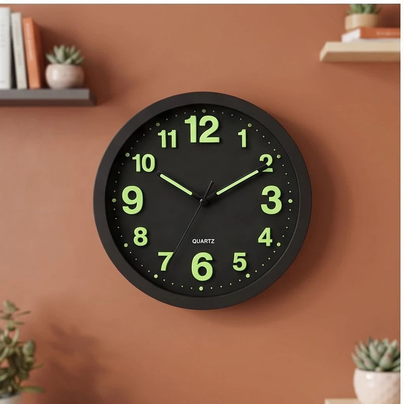 Black clock styled in a warm home setting
