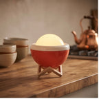 Orange lamp styled in a warm home setting