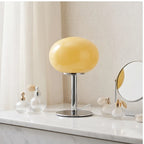 Creamy Custard Oval lamp styled in a warm home setting - 3