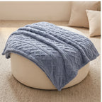 Blue fleece throw styled in a warm home setting - 2