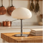 White glass lamp styled in a warm home setting