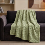 Green fleece throw styled in a warm home setting - 2