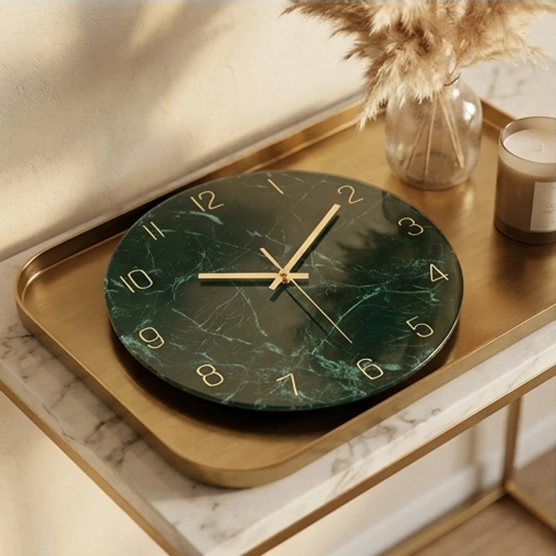 Green marble glass wall clock with gold numbers and hands.