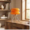 Orange lamp styled in a warm home setting