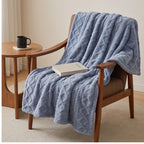 Blue fleece throw styled in a warm home setting