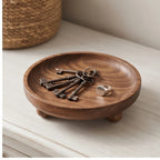Walnut ball A wooden tray styled in a warm home setting - 2