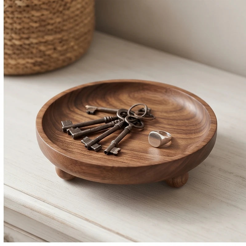 Walnut ball A wooden tray styled in a warm home setting - 2