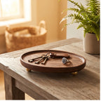 brass ball B wooden tray styled in a warm home setting