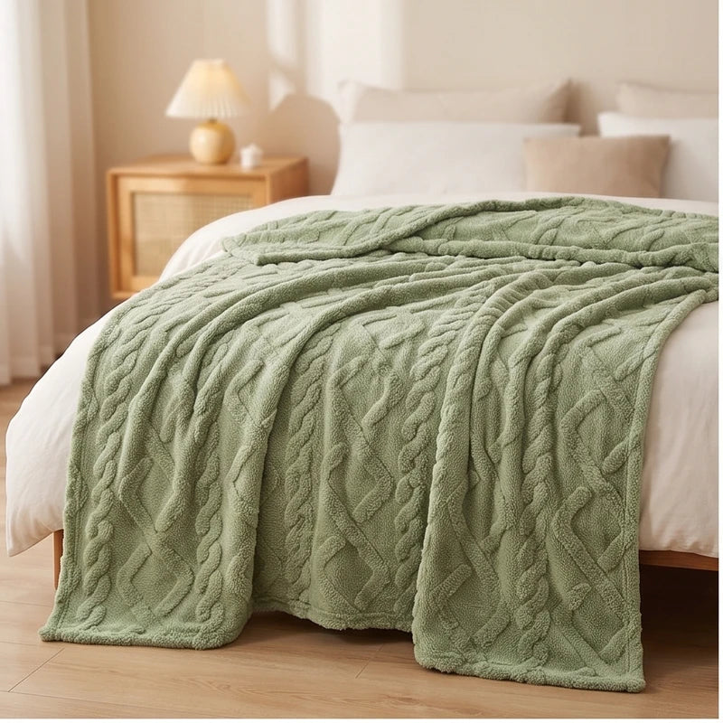 Green fleece blanket styled in a warm home setting