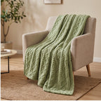 Green fleece throw styled in a warm home setting