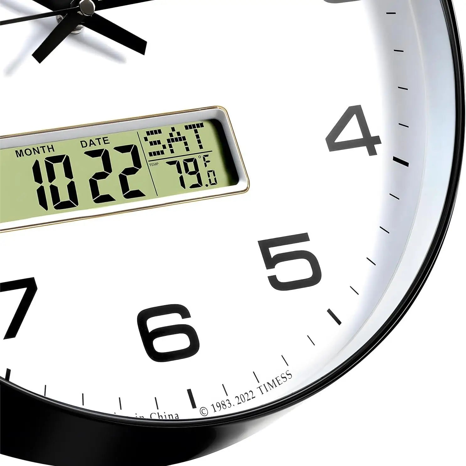 Black analog clock with digital calendar and temperature display.
