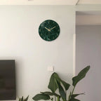 Green marble tempered glass wall clock with gold hands.