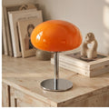 Orange glass lamp styled in a warm home setting - 2