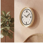 Black clock styled in a warm home setting - 2