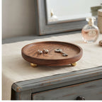Brass ball A wooden tray styled in a warm home setting - 2
