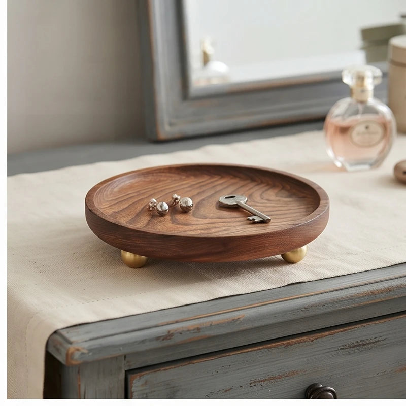 Brass ball A wooden tray styled in a warm home setting - 2