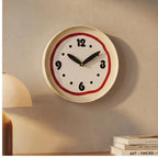 Red clock styled in a warm home setting - 2