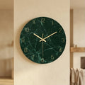 Green tempered glass wall clock with gold hands and numbers.