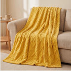 Yellow fleece blanket styled in a warm home setting - 2