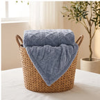 Blue fleece throw styled in a warm home setting - 3