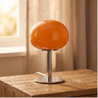 Orange lamp styled in a warm home setting
