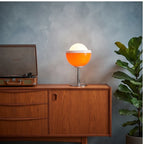 Orange lamp styled in a warm home setting - 3