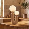 Pink lamp styled in a warm home setting