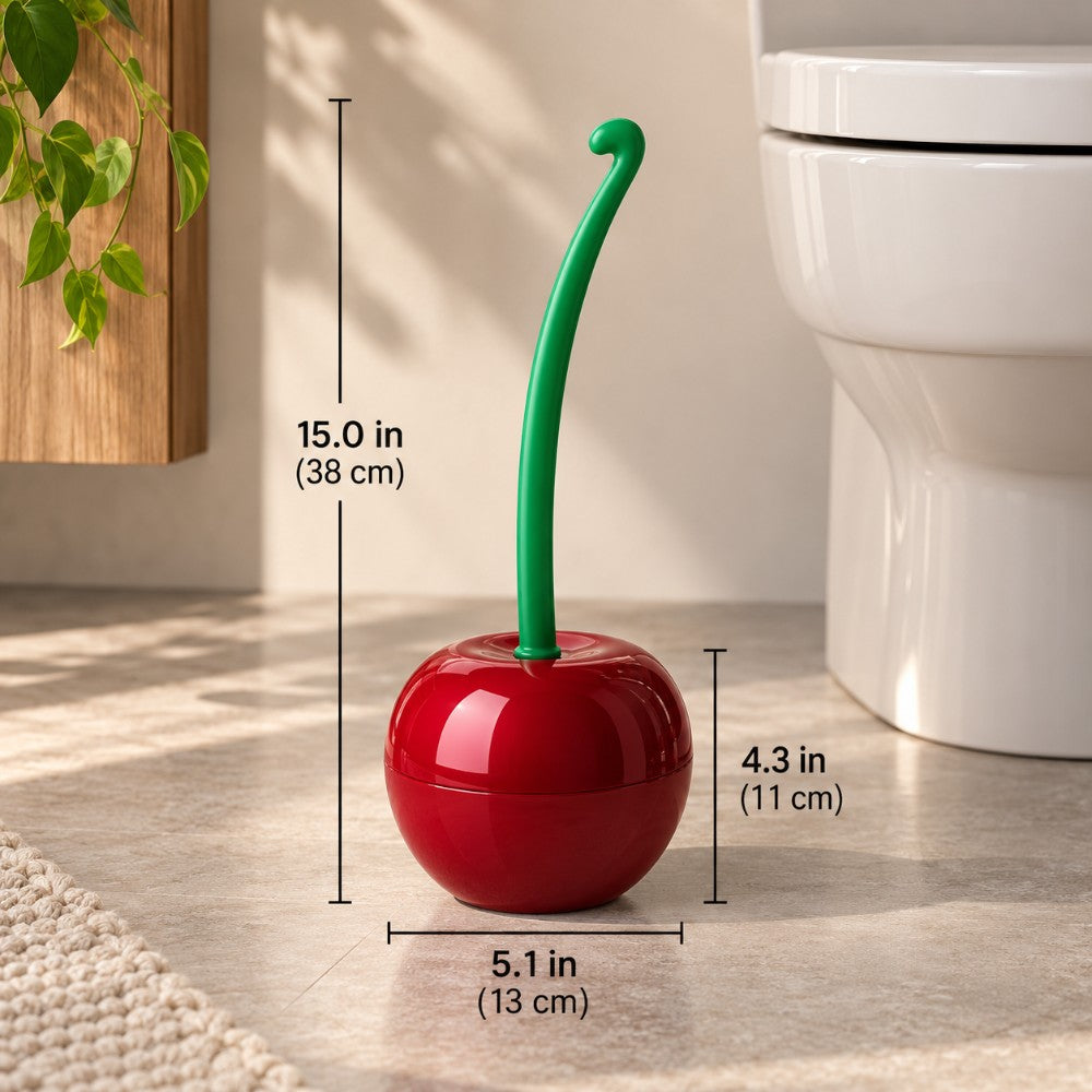 Glossy red cherry-shaped holder with a bright green stem sits on a tiled floor next to a white toilet.