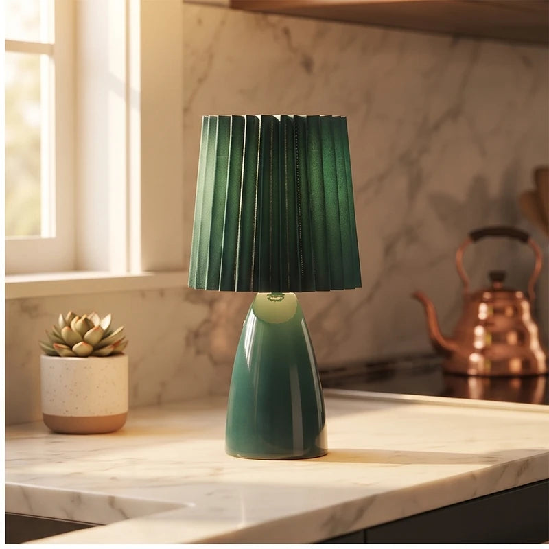 Green ceramic lamp styled in a warm home setting