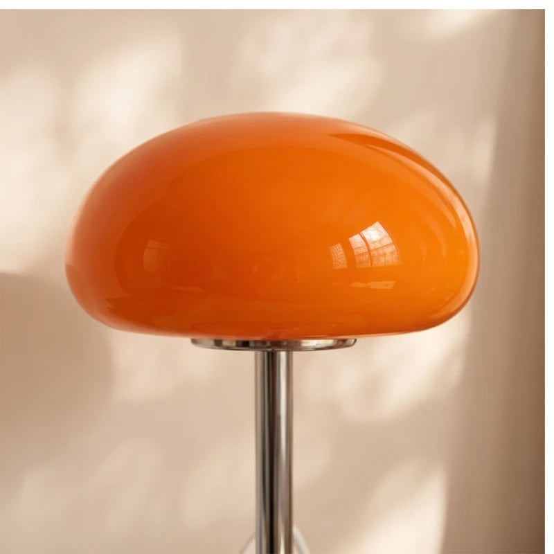 Orange glass lamp styled in a warm home setting - 3