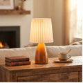 Orange ceramic lamp styled in a warm home setting