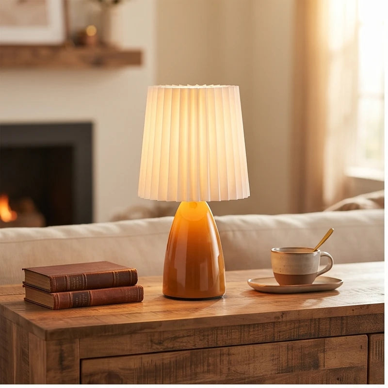 Orange ceramic lamp styled in a warm home setting