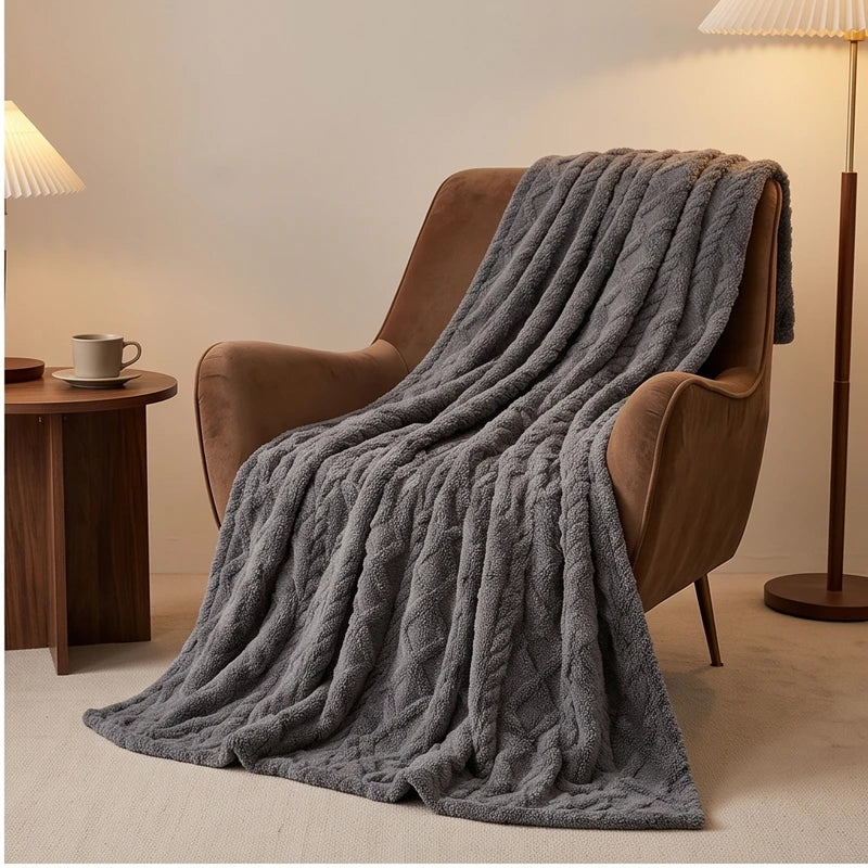 Gray fleece throw styled in a warm home setting