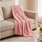 Pink fleece throw styled in a warm home setting