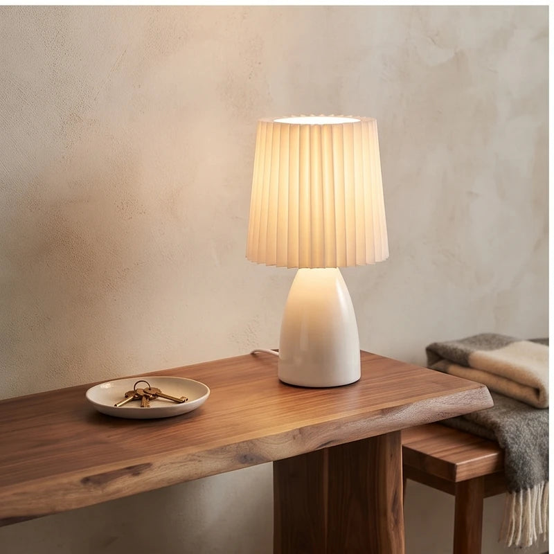 White ceramic lamp styled in a warm home setting - 2