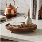 brass ball B wooden tray styled in a warm home setting - 2
