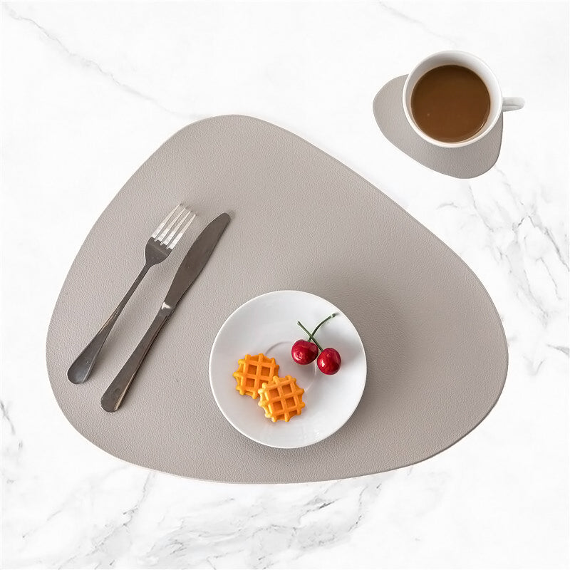 Gray leather modern placemat and coaster set.